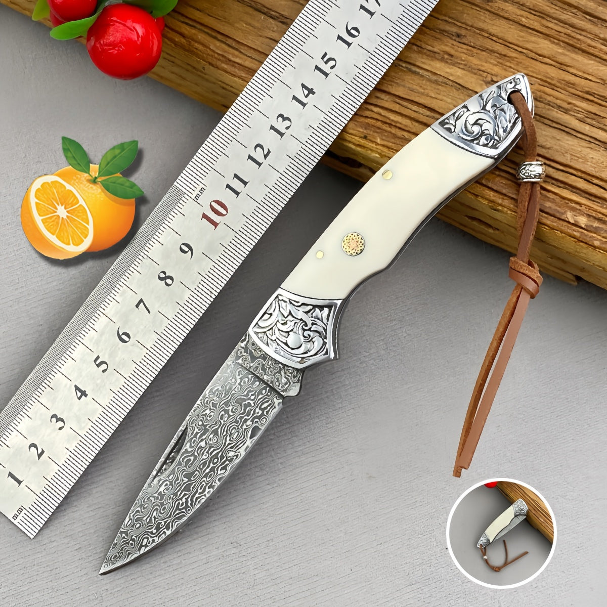 Handmade Damascus Steel Folding Knife Intricate Metal Engravings & Leather Lanyard – EDC Tool for Camping, Hunting & Daily Use