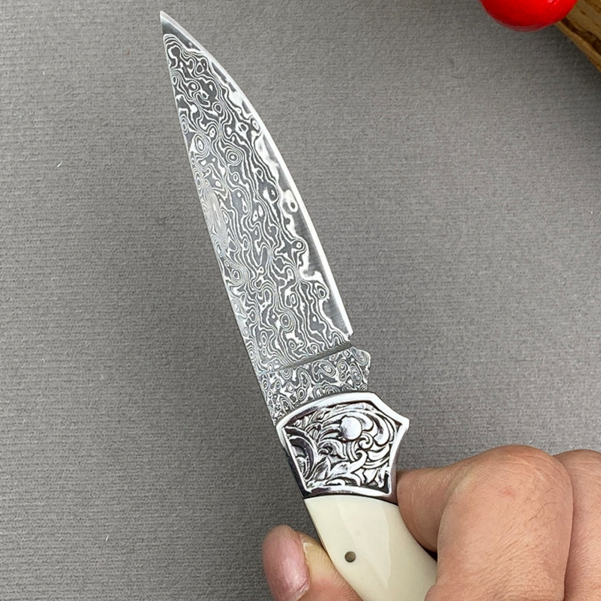 Handmade Damascus Steel Folding Knife Intricate Metal Engravings & Leather Lanyard – EDC Tool for Camping, Hunting & Daily Use